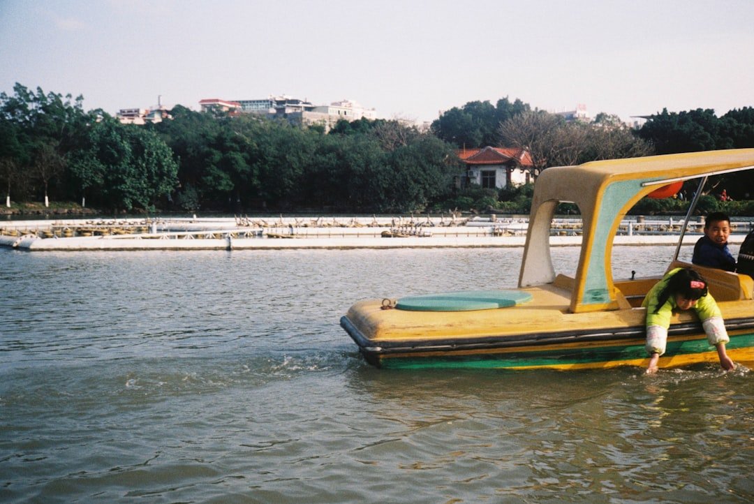 a couple of people on a boat in the water