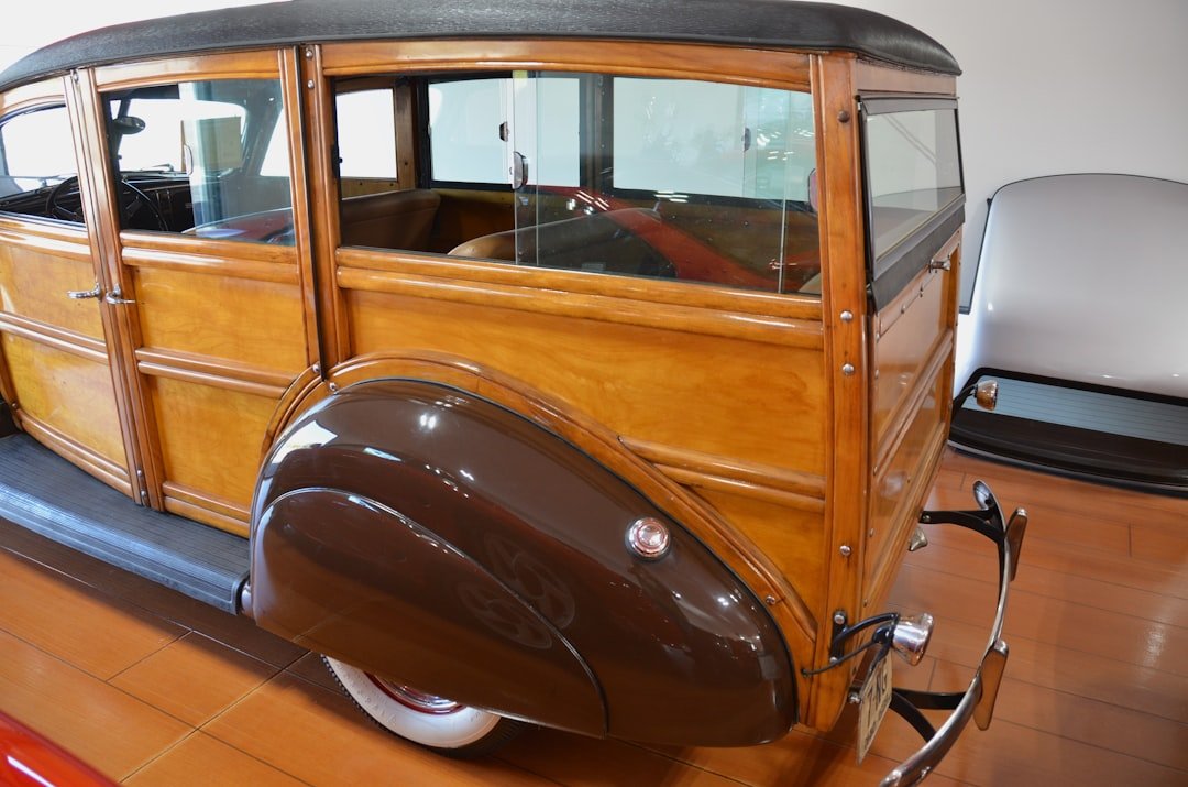 an antique car is on display in a museum