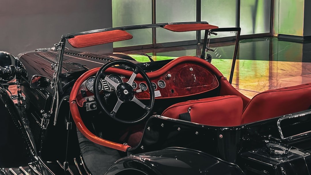 A red and black motorcycle parked in a garage