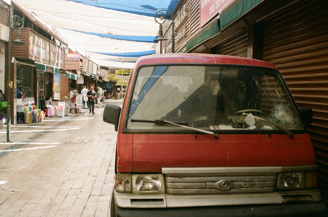 a red truck parked on the side of a street