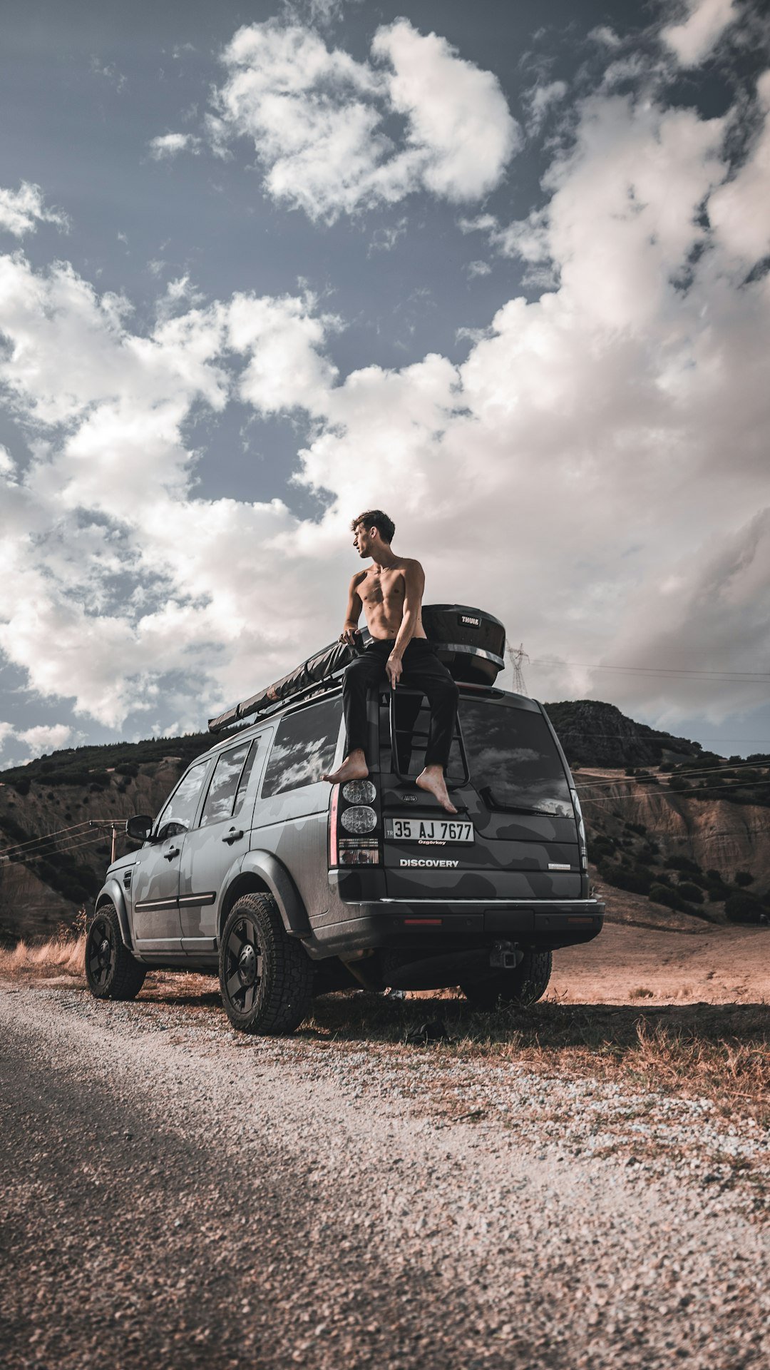 a person sitting on a car