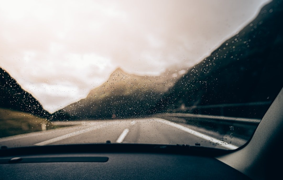 a view of mountains from inside a car