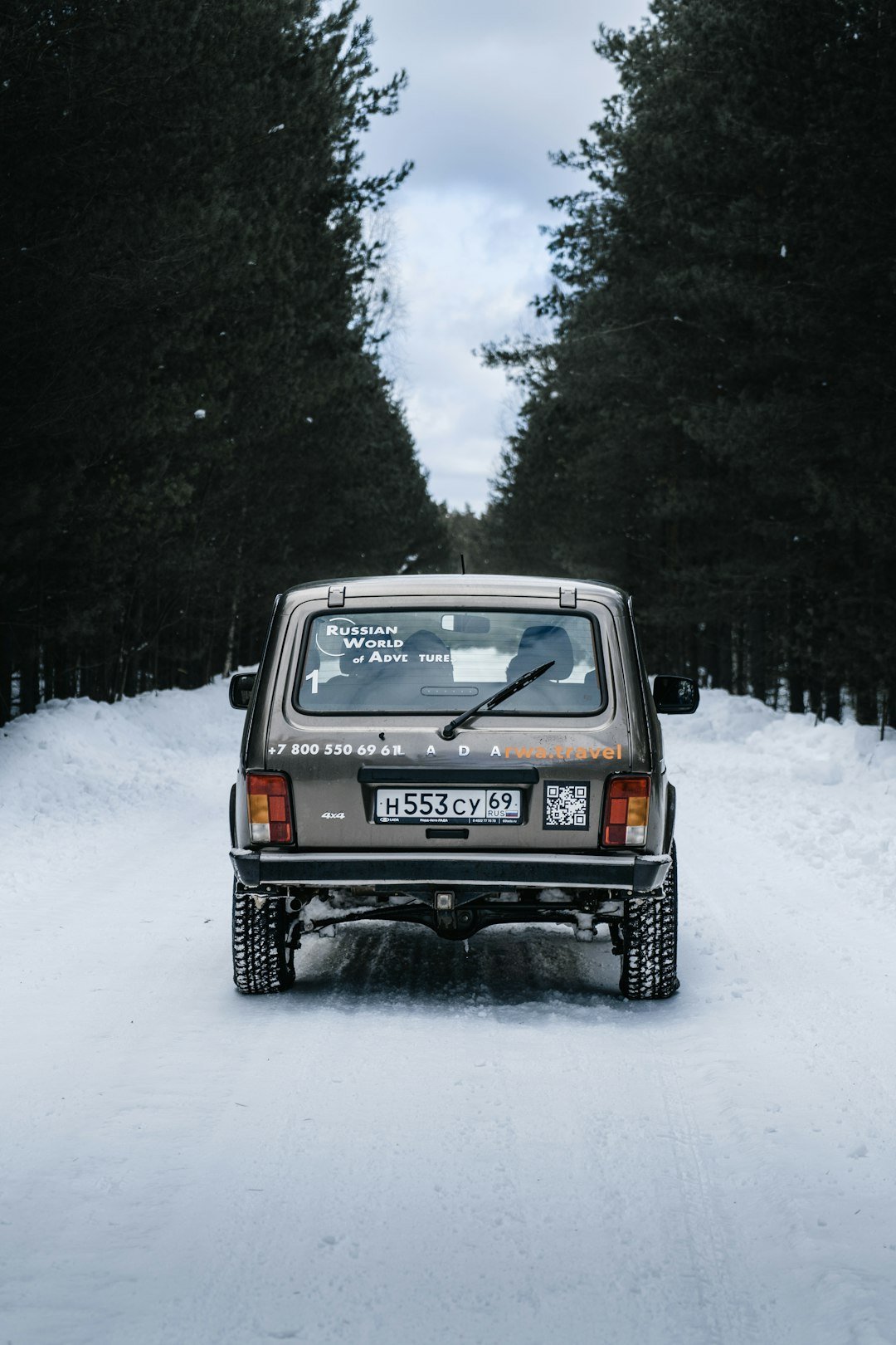 a car driving on a snowy road