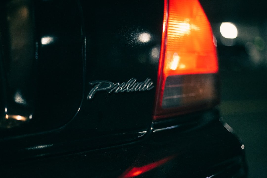 the back end of a black car with the word prestige on it