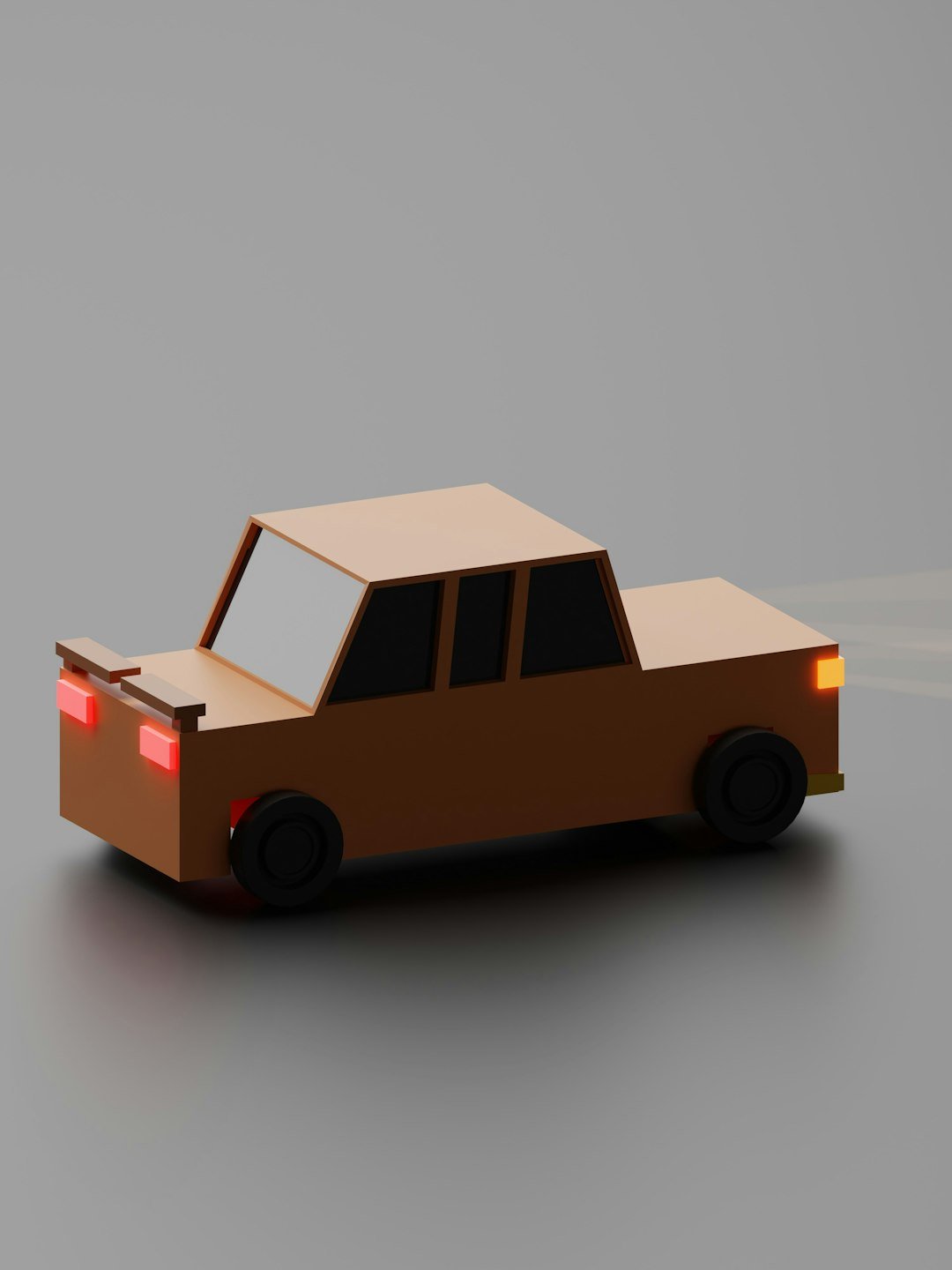 a paper model of a car on a gray background