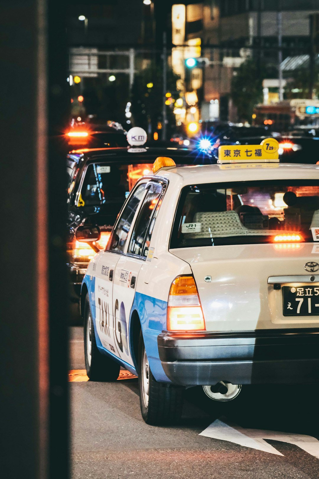 a police car is stopped at an intersection