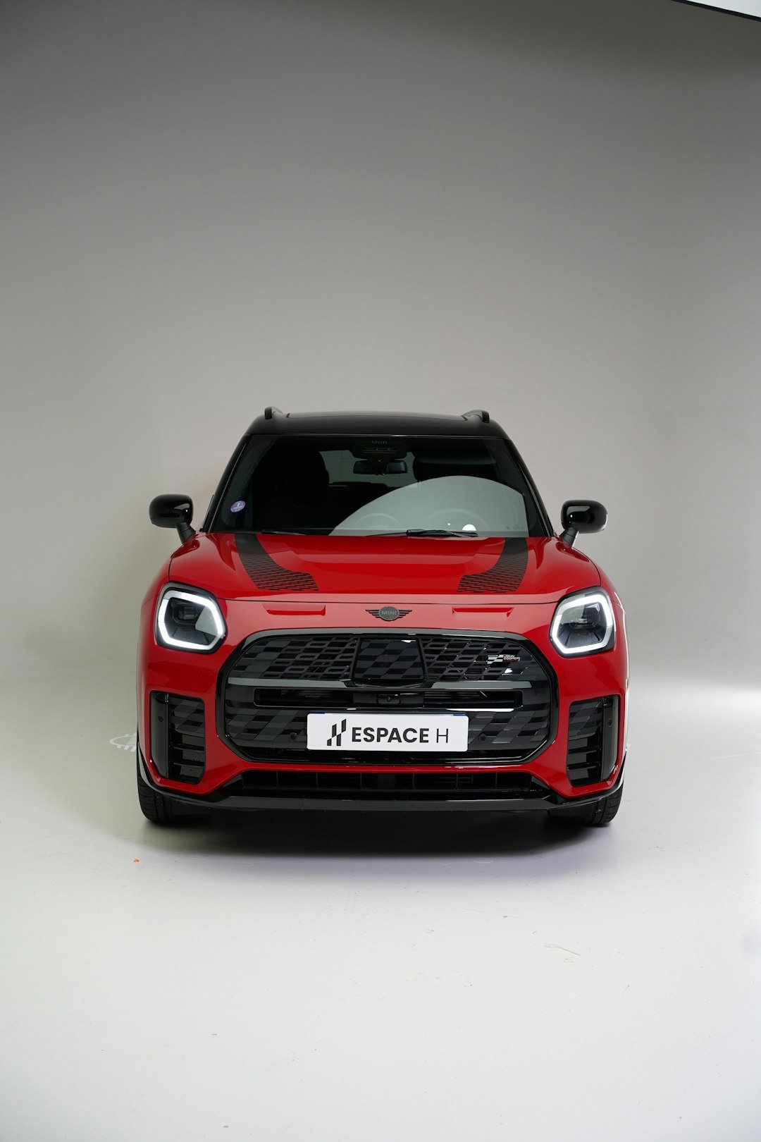 Red mini cooper countryman parked indoors