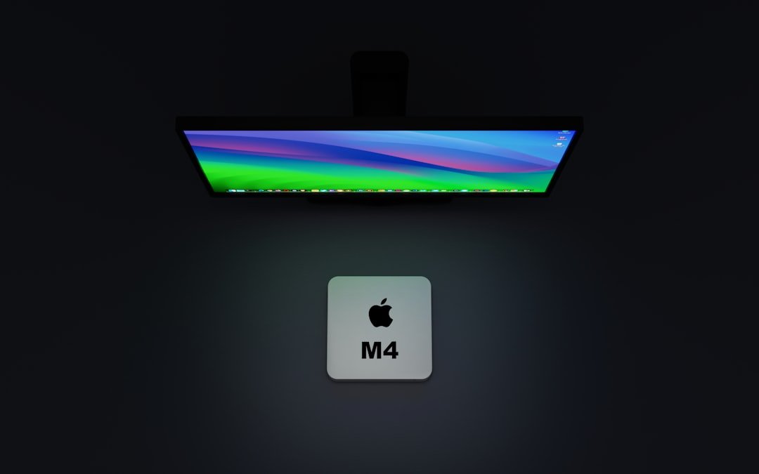 an apple logo is displayed in front of a monitor