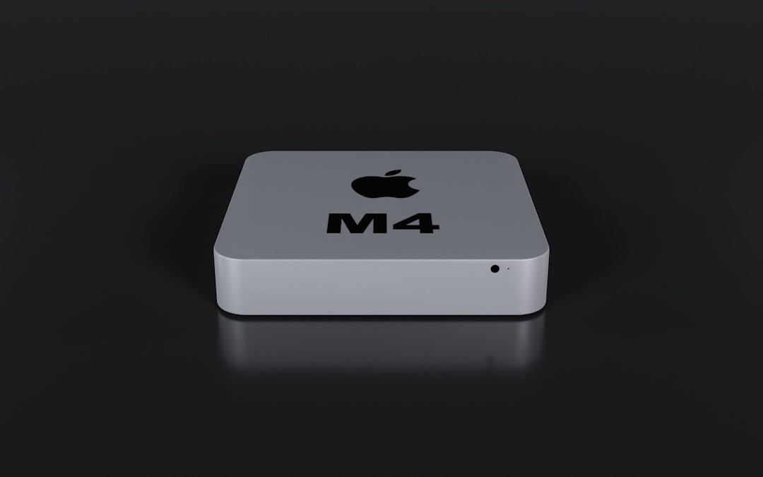 a close up of an apple product on a black surface