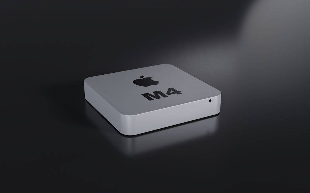 a close up of an apple product on a black surface