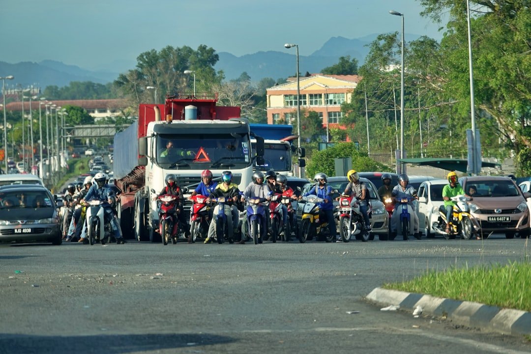 Motorcycles and cars stuck in heavy traffic