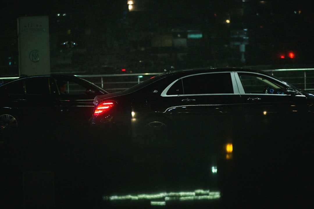 a couple of cars that are sitting in the dark