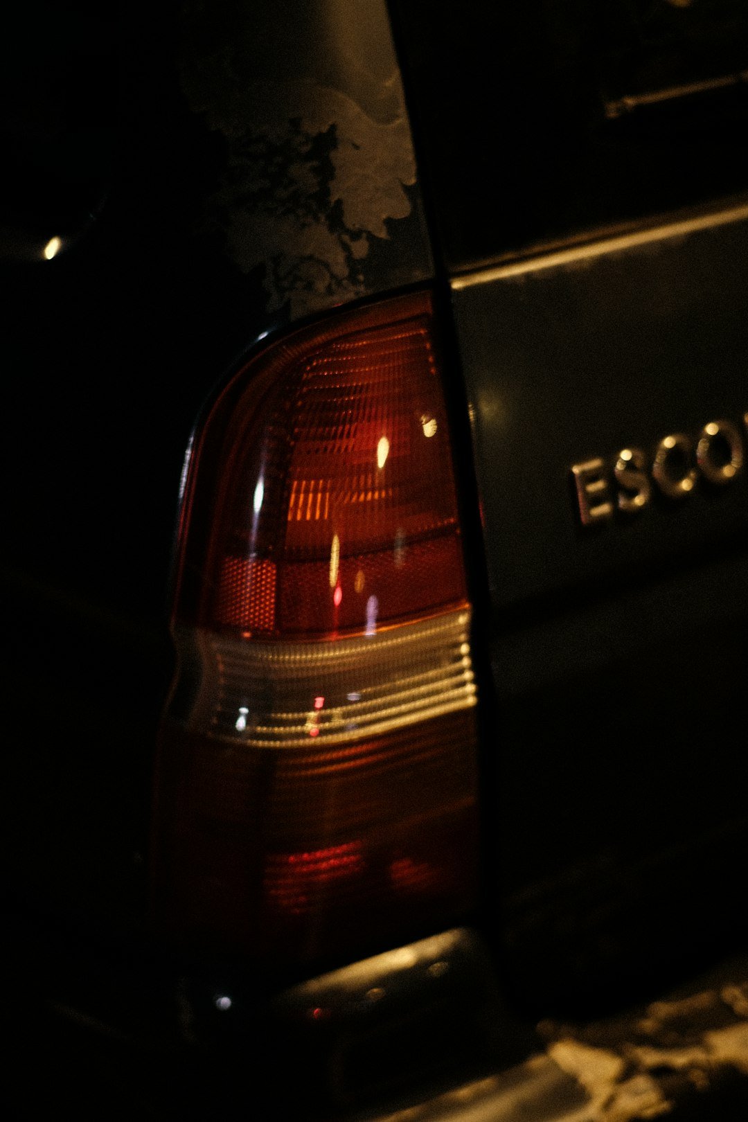 a close up of the tail light of a car