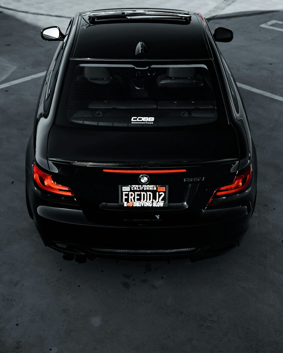 a black car parked in a parking lot