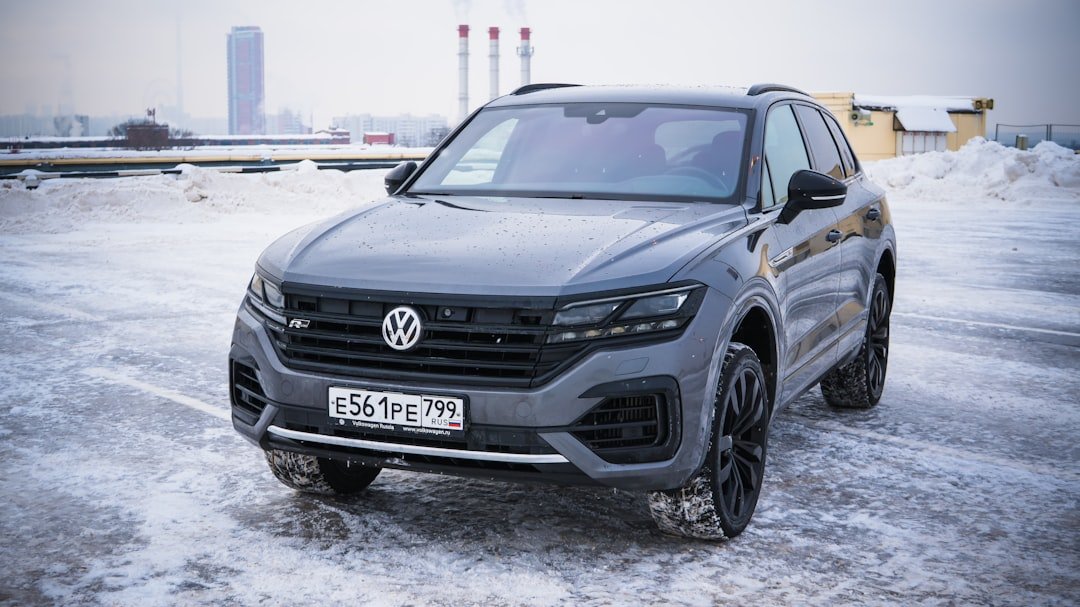 Gray volkswagen touareg parked on snowy ground
