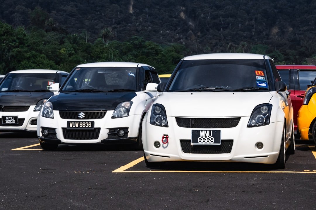 a group of cars parked in a parking lot
