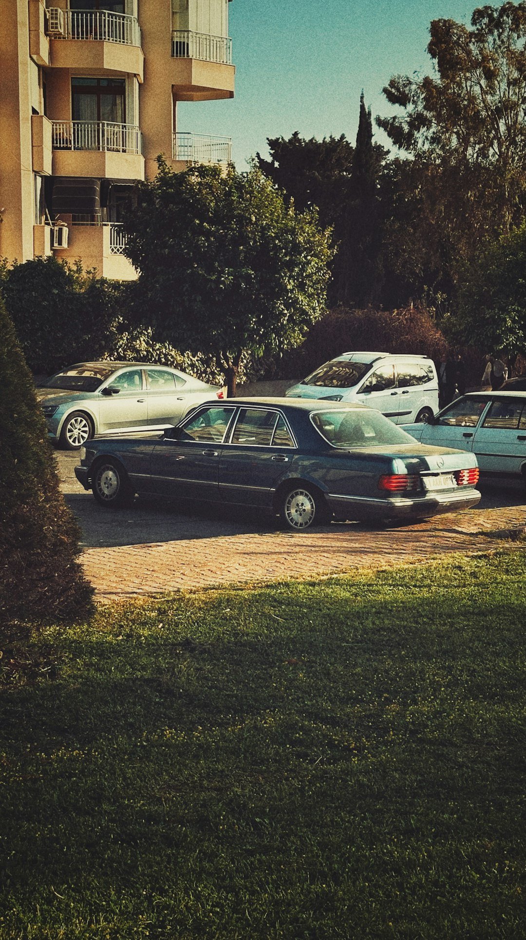 A group of cars parked in a parking lot