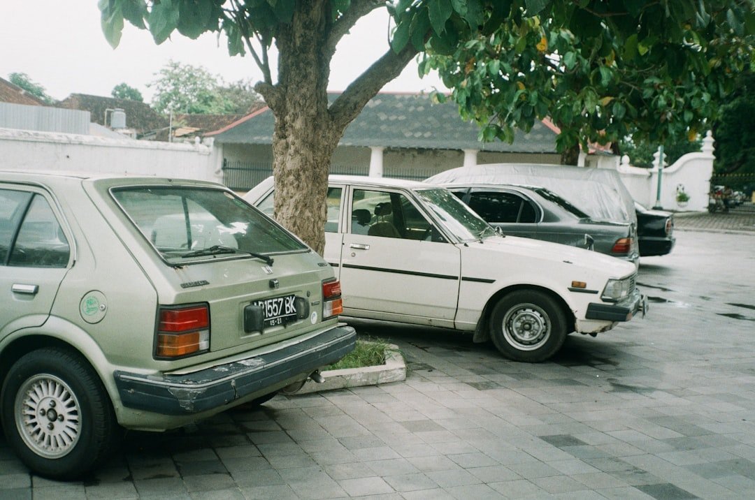 white bmw x 6 parked on sidewalk during daytime