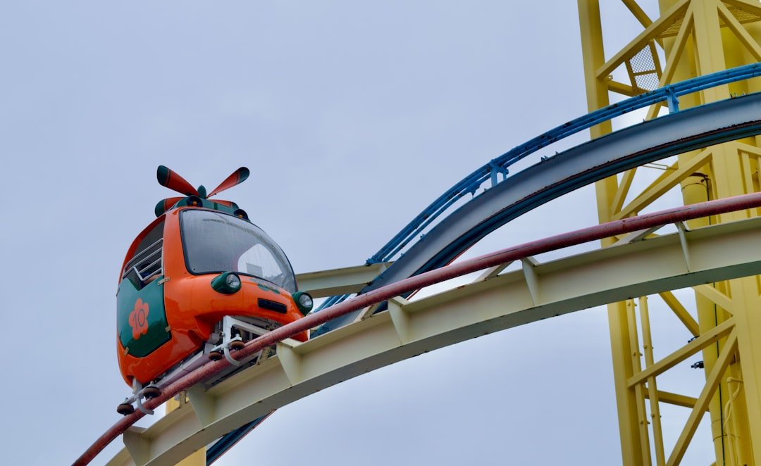Orange roller coaster car on a track