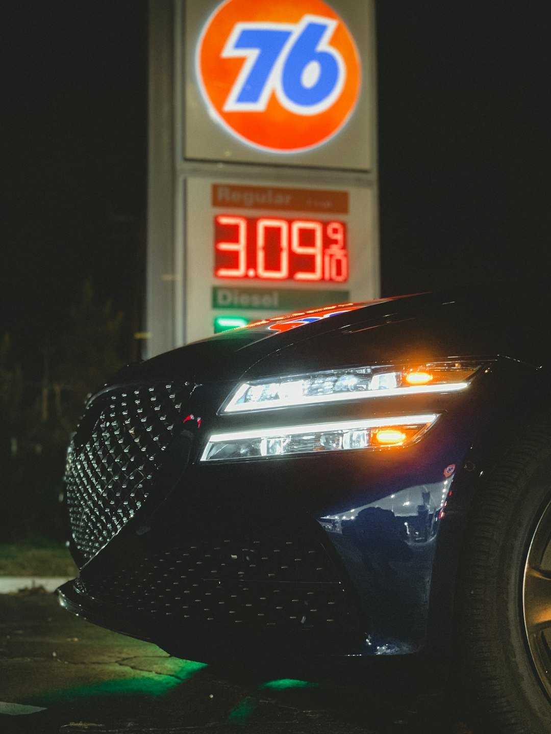 a car parked in front of a gas station