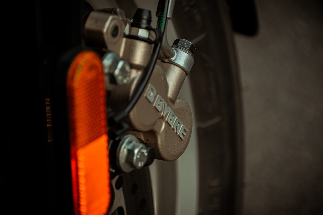 orange and silver bicycle wheel