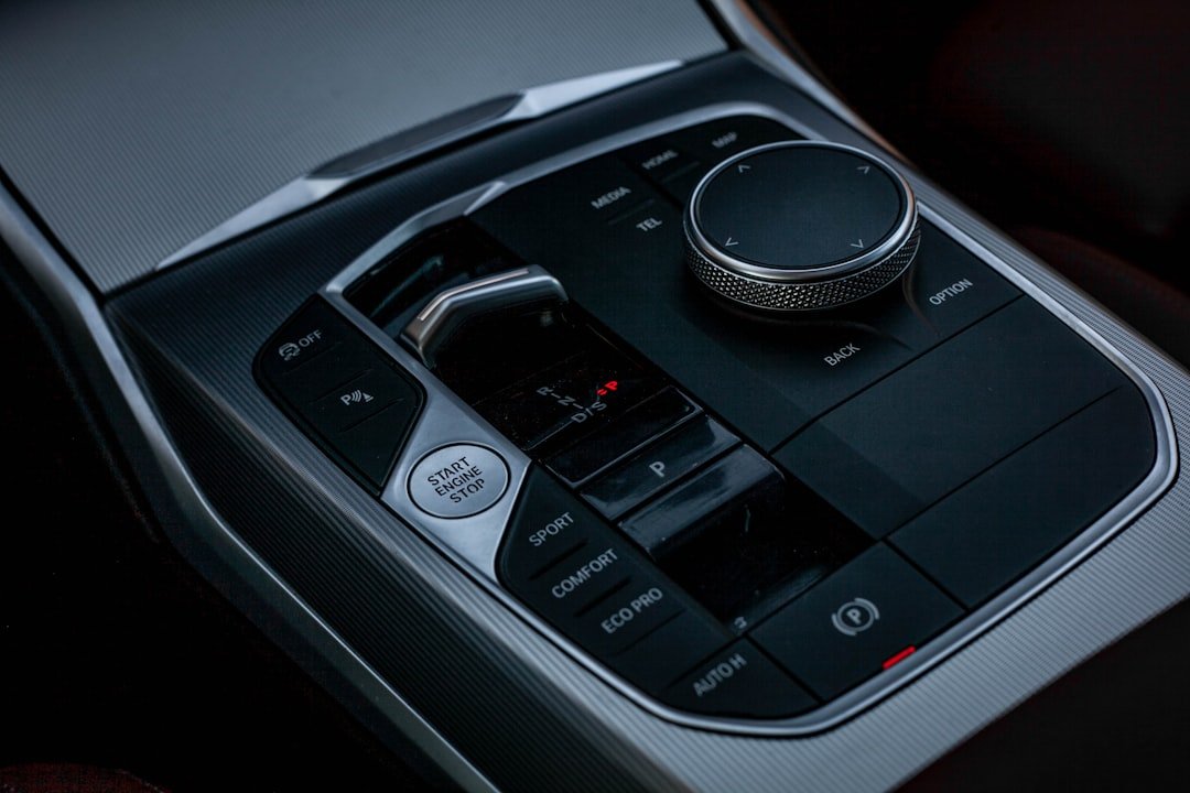 Close-up of modern car's center console controls.