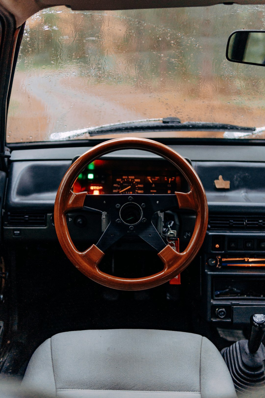 a car with a steering wheel and dashboard