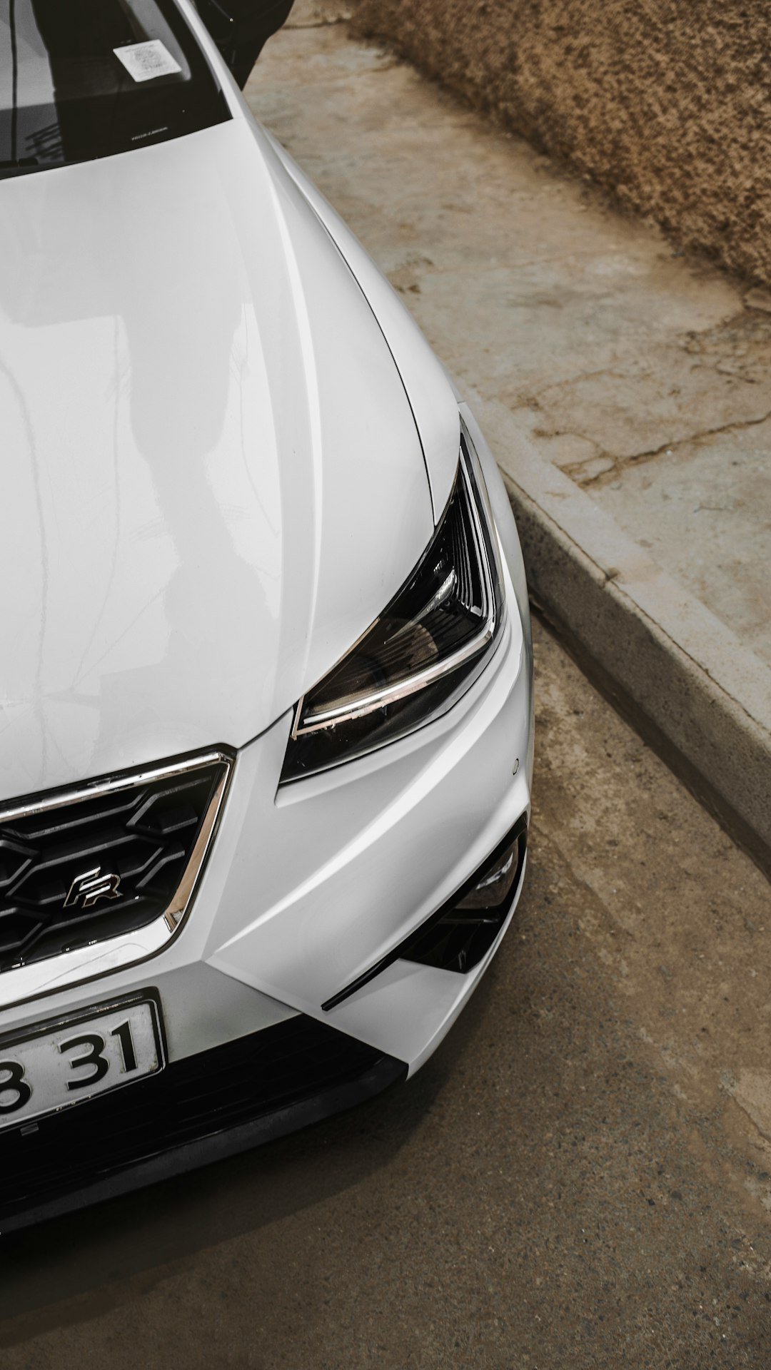 a white car parked on the side of the road