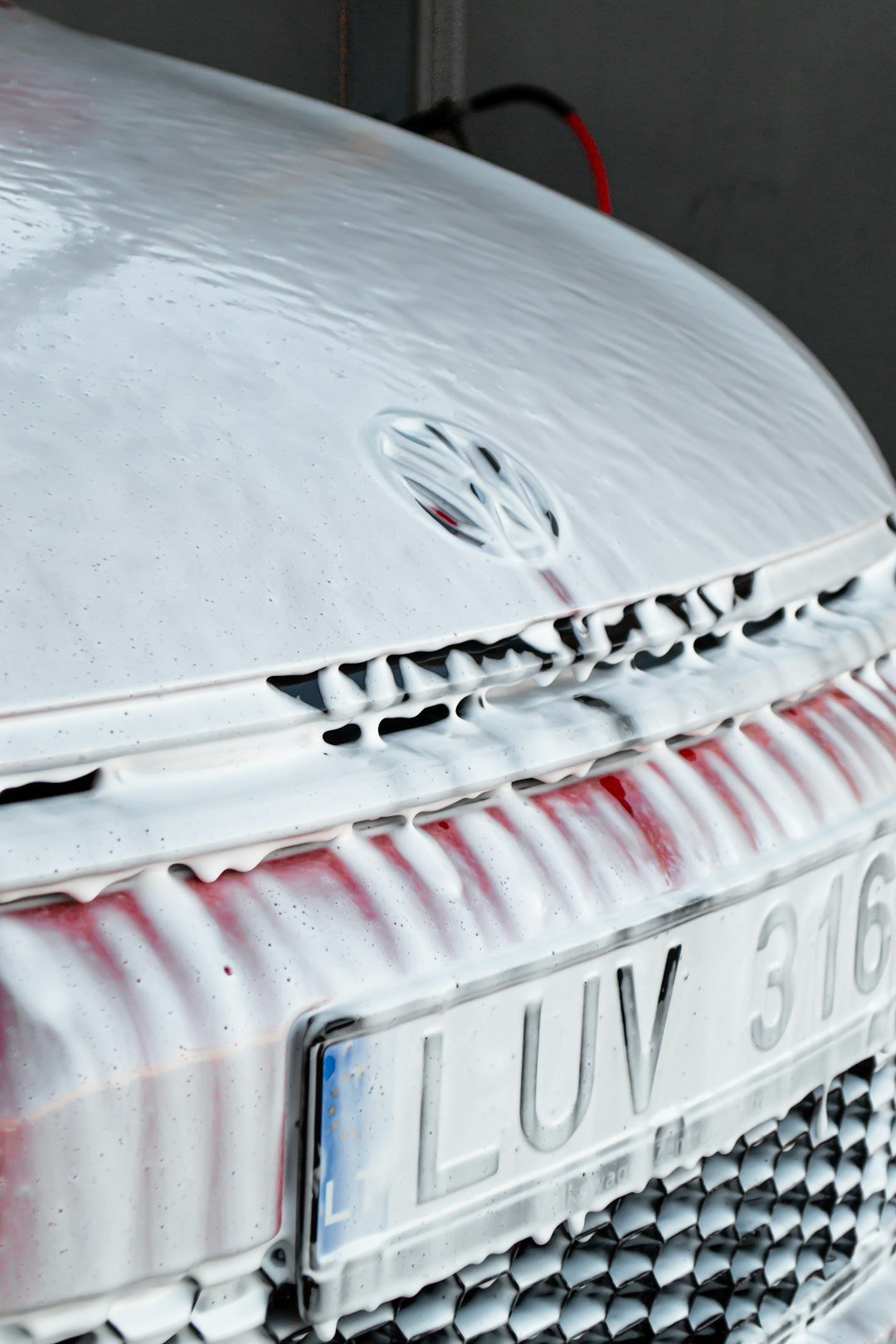 a close up of the front of a white car