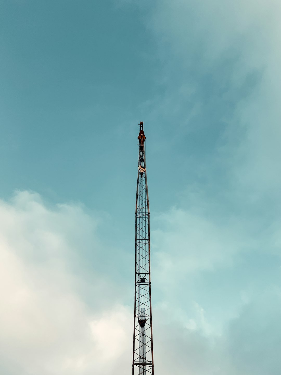 red and black tower under blue sky