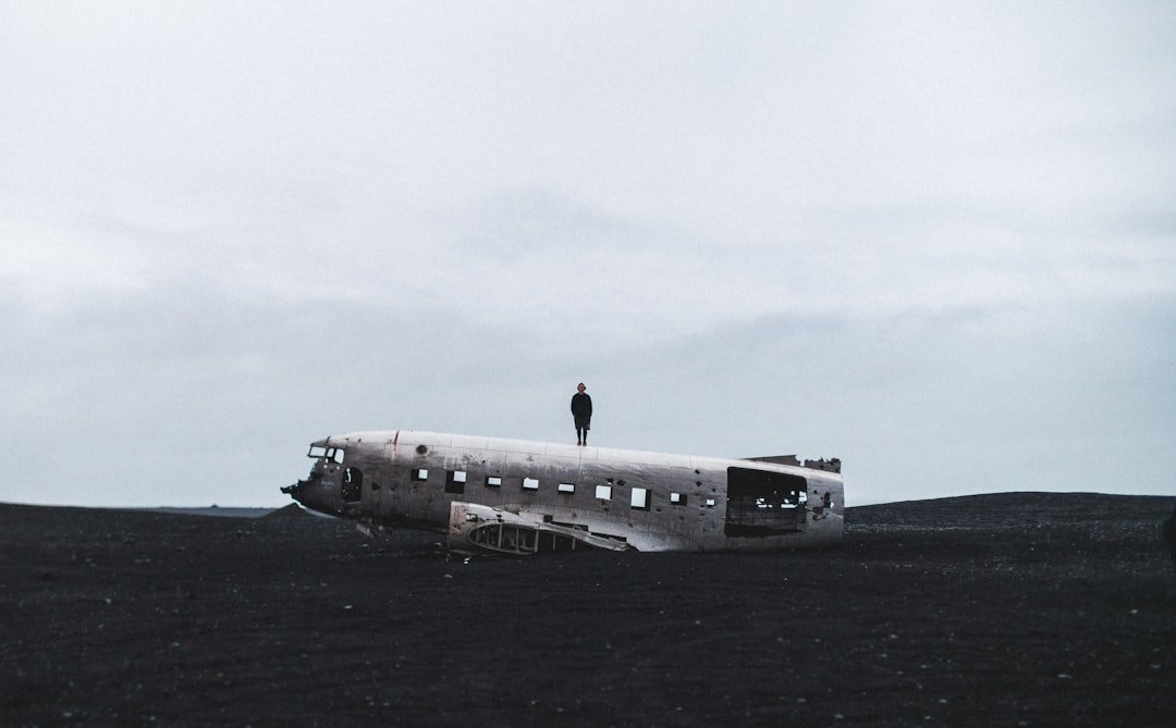 person standing on crushed plane