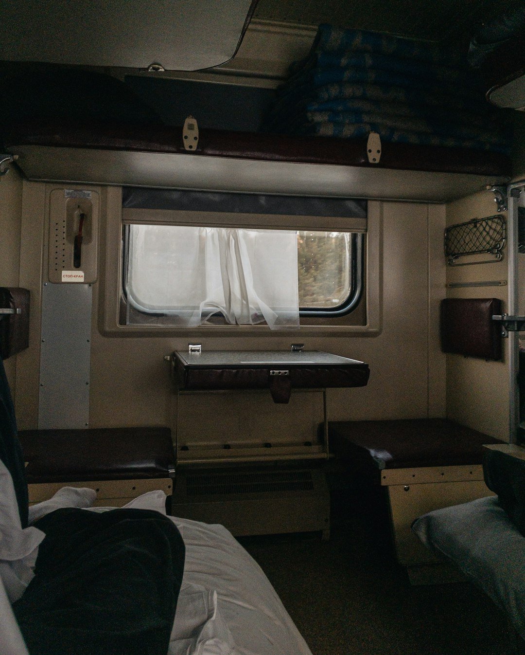 a bedroom with a sink and a window