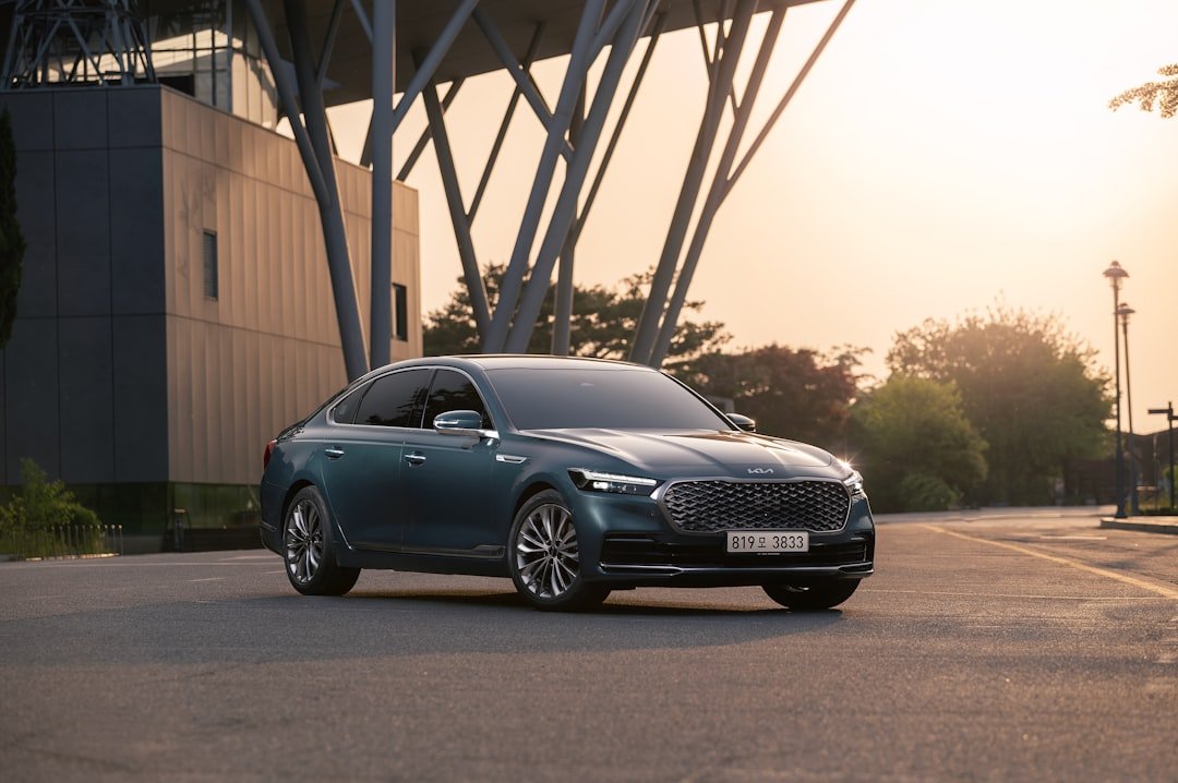 a blue car parked on the side of a road