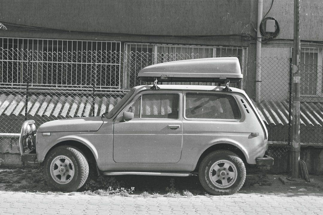 a small car parked in front of a building