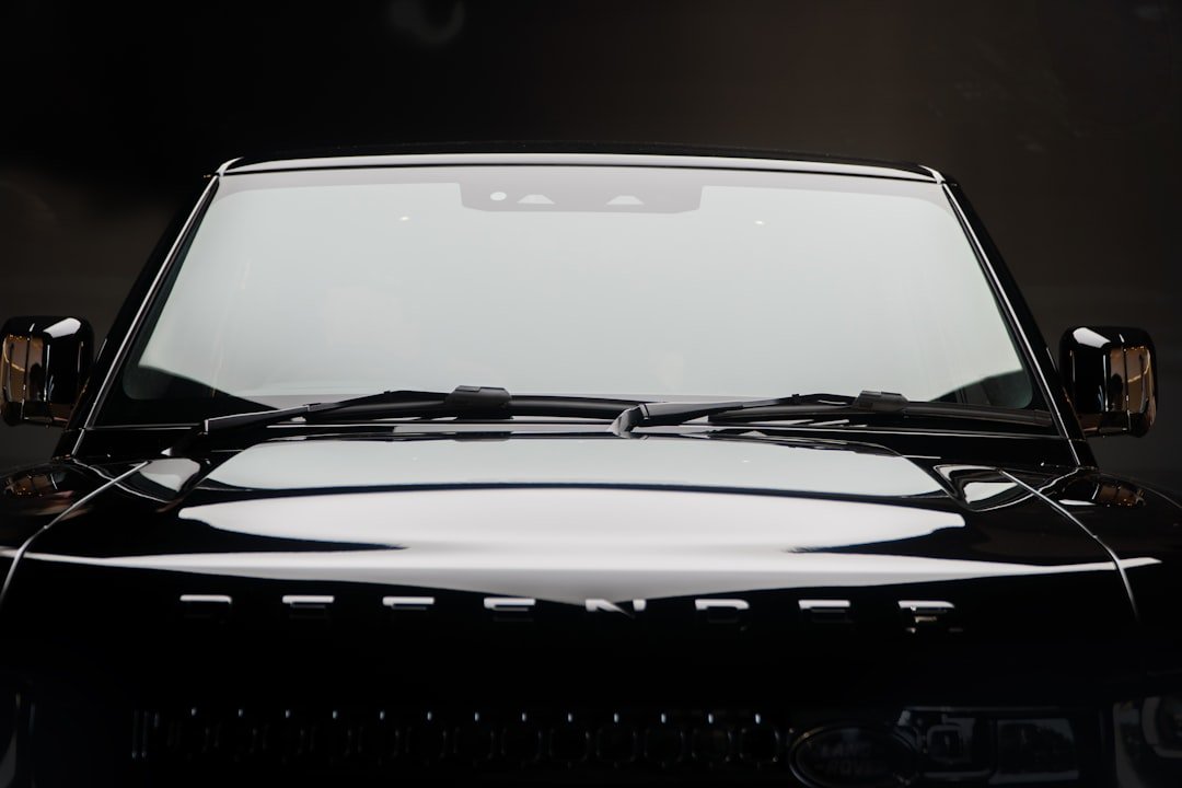 A black suv's front end is depicted.