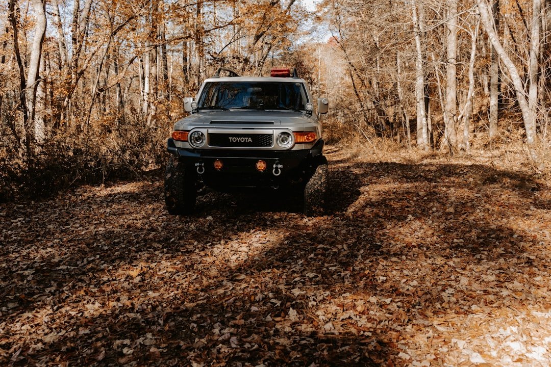 a car driving on a dirt road