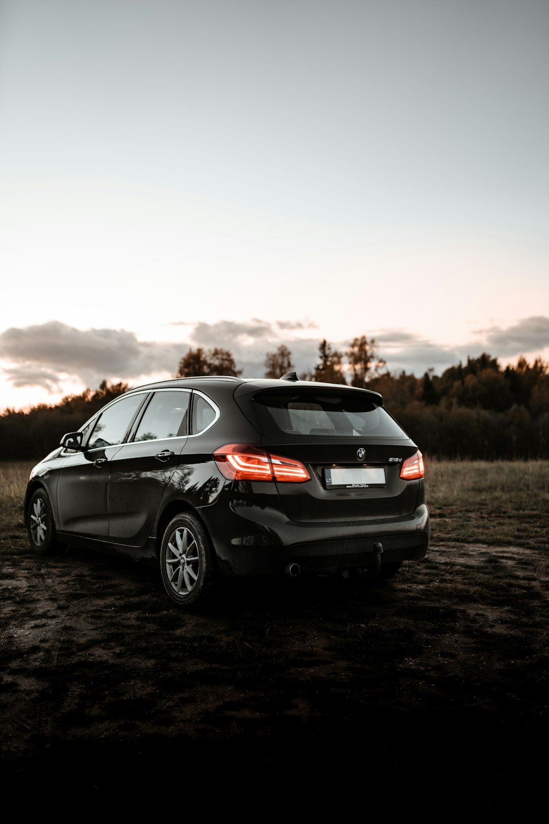 gray honda sedan on dirt road during daytime