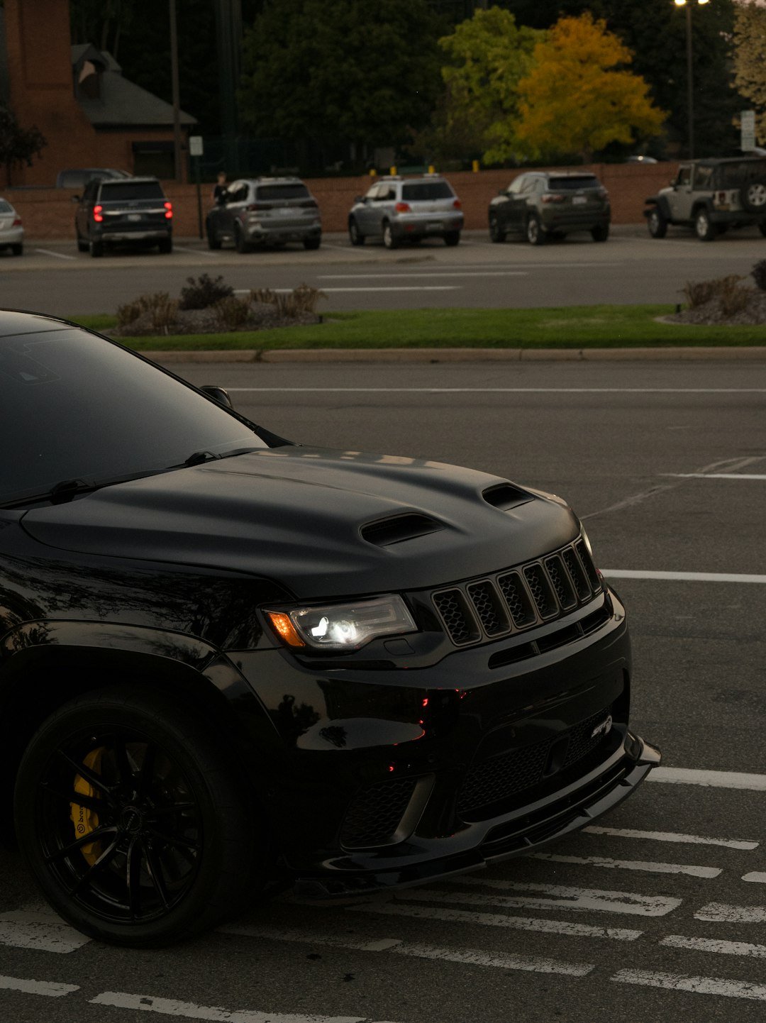 Black jeep grand cherokee srt parked on street