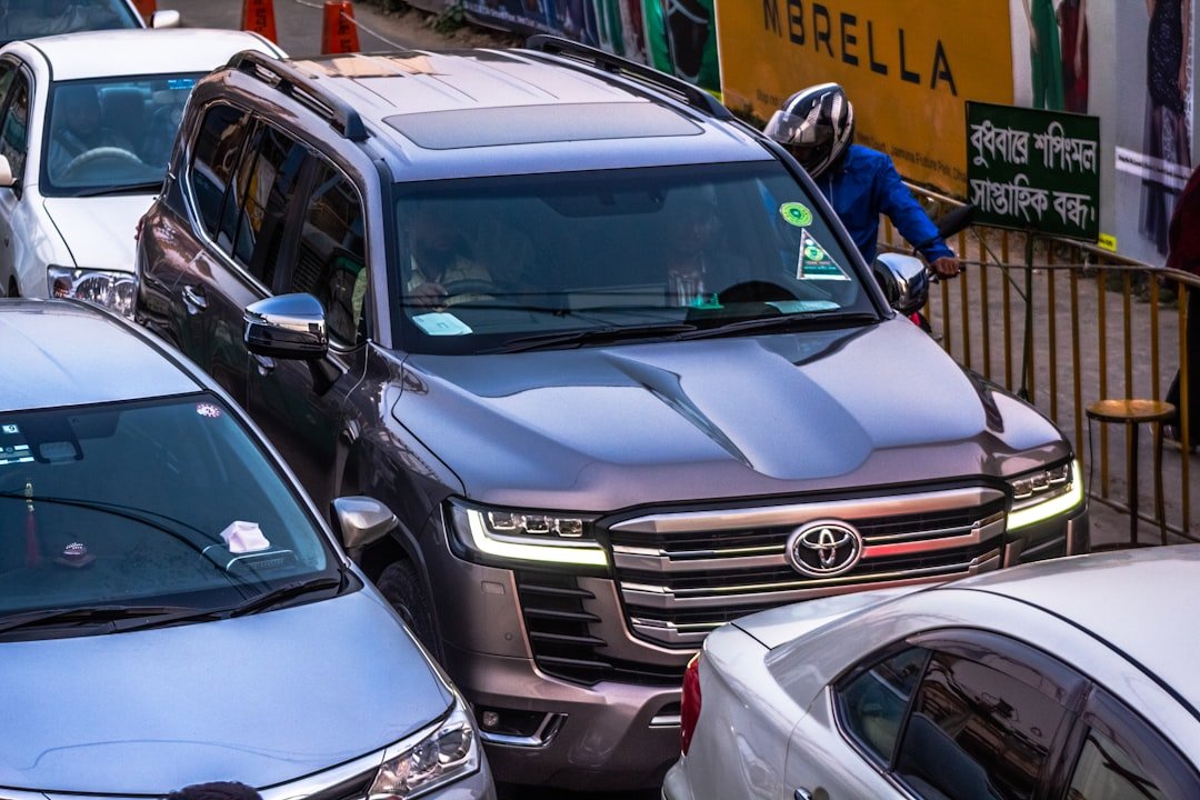 a bunch of cars parked on the side of the road