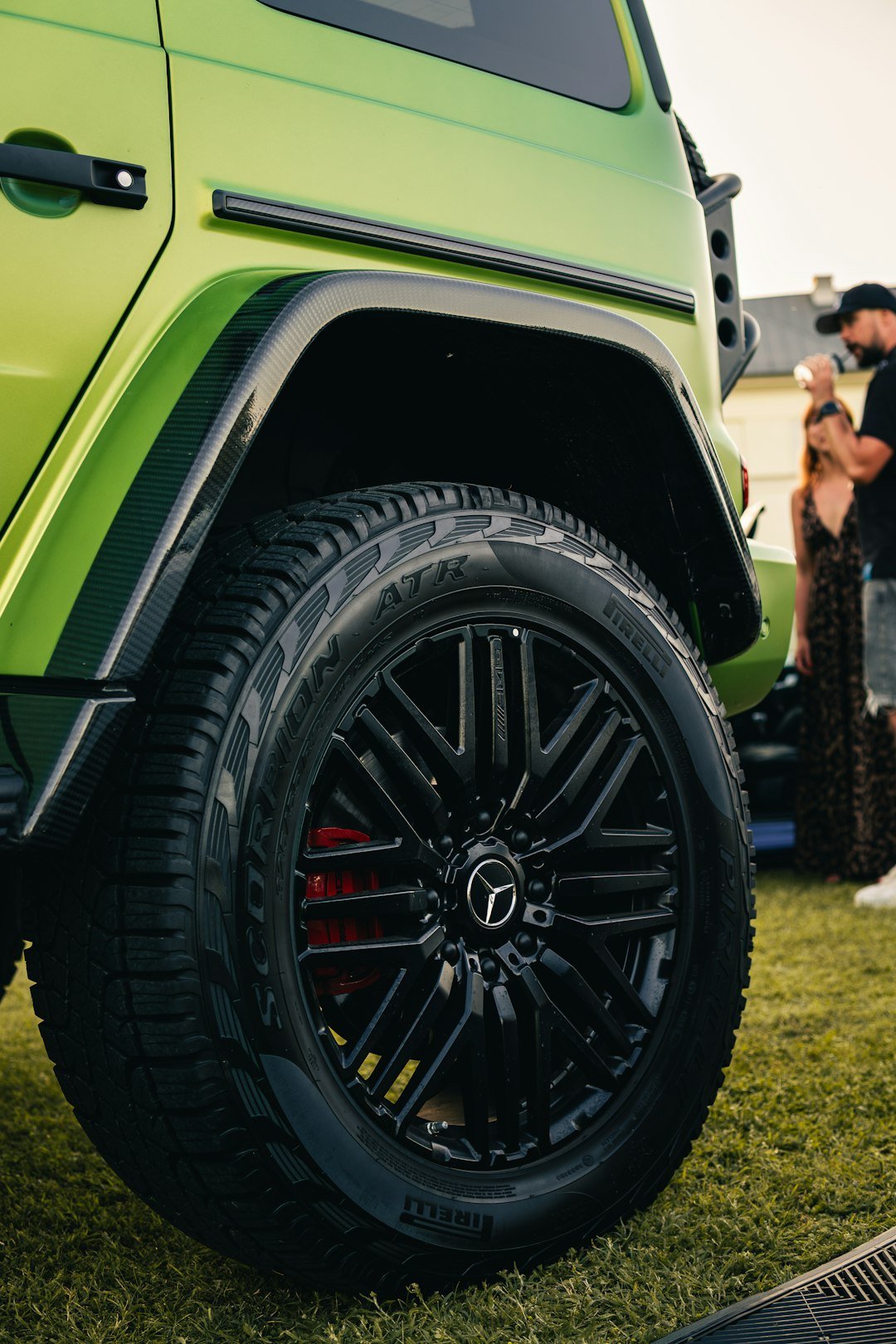 Close-up of a lime green mercedes g-wagon wheel.