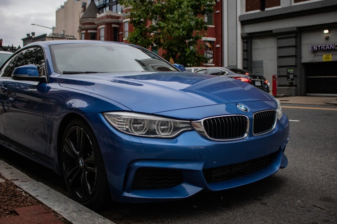 A blue car parked on the side of the road