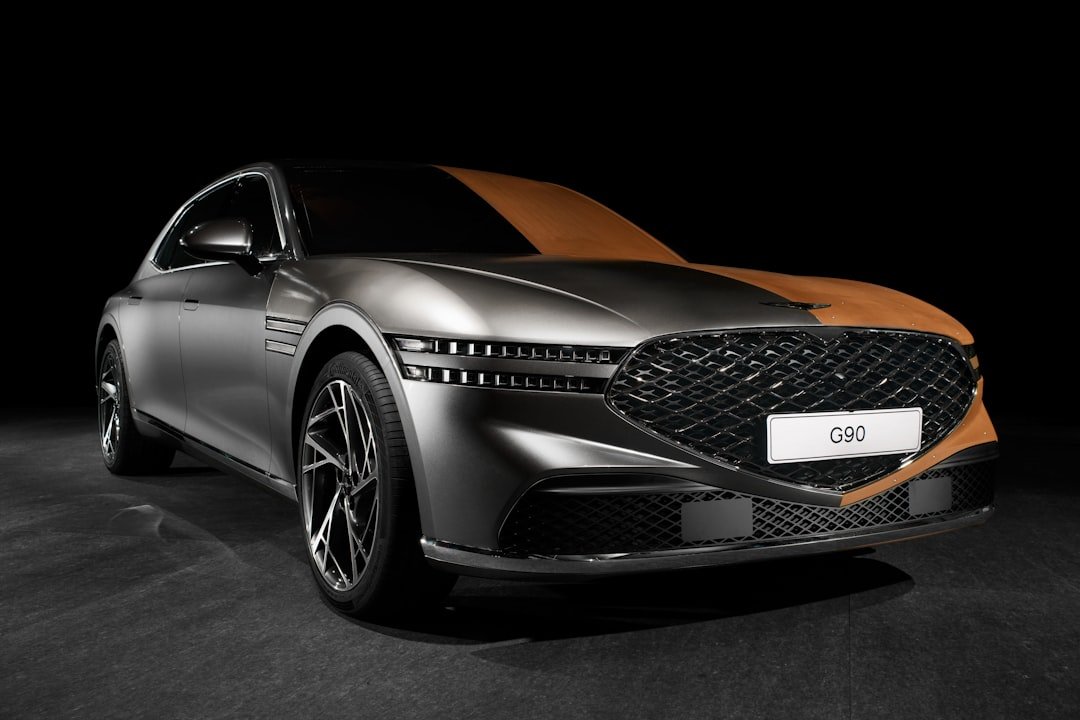 a silver and orange car in a dark room