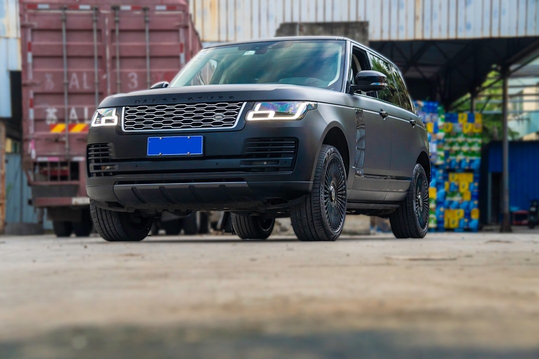 a black suv parked in front of a building