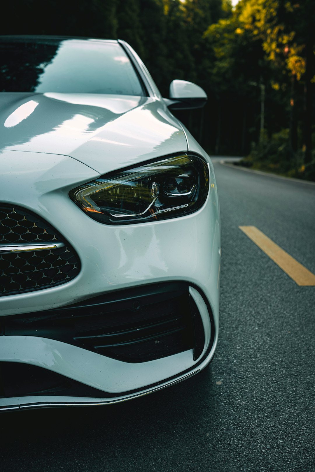 A white car parked on the side of the road
