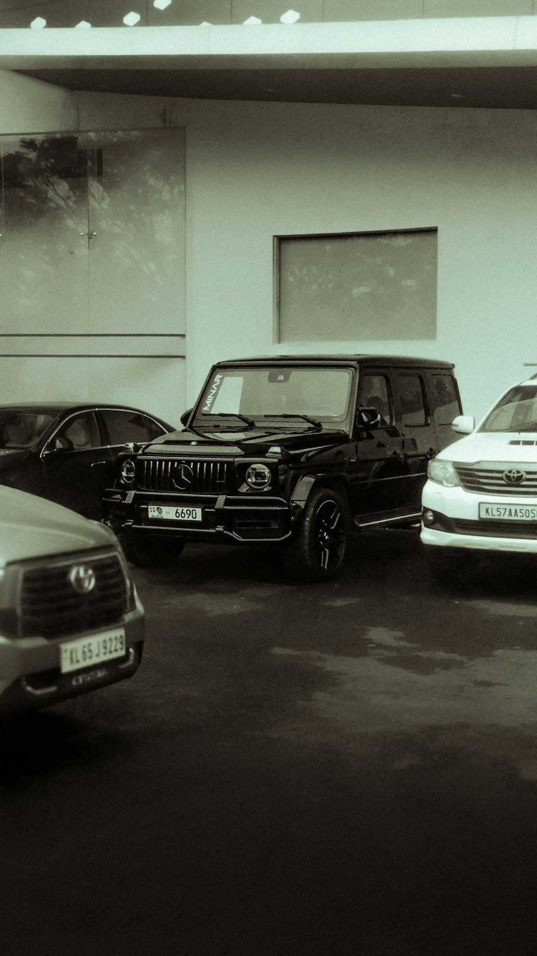 Several cars parked in front of a building