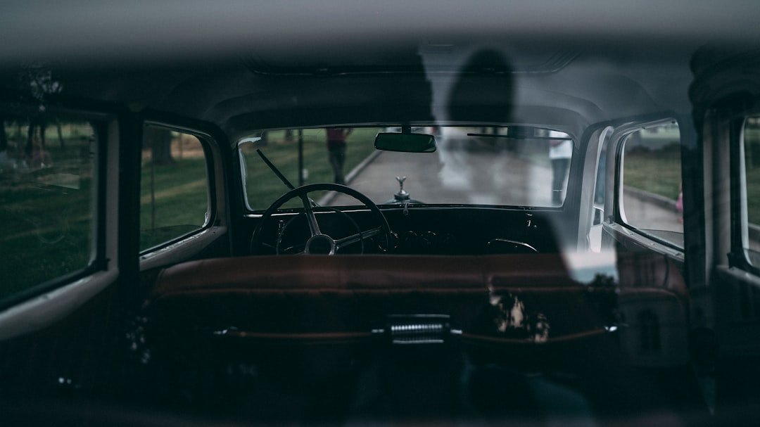 black car with open door