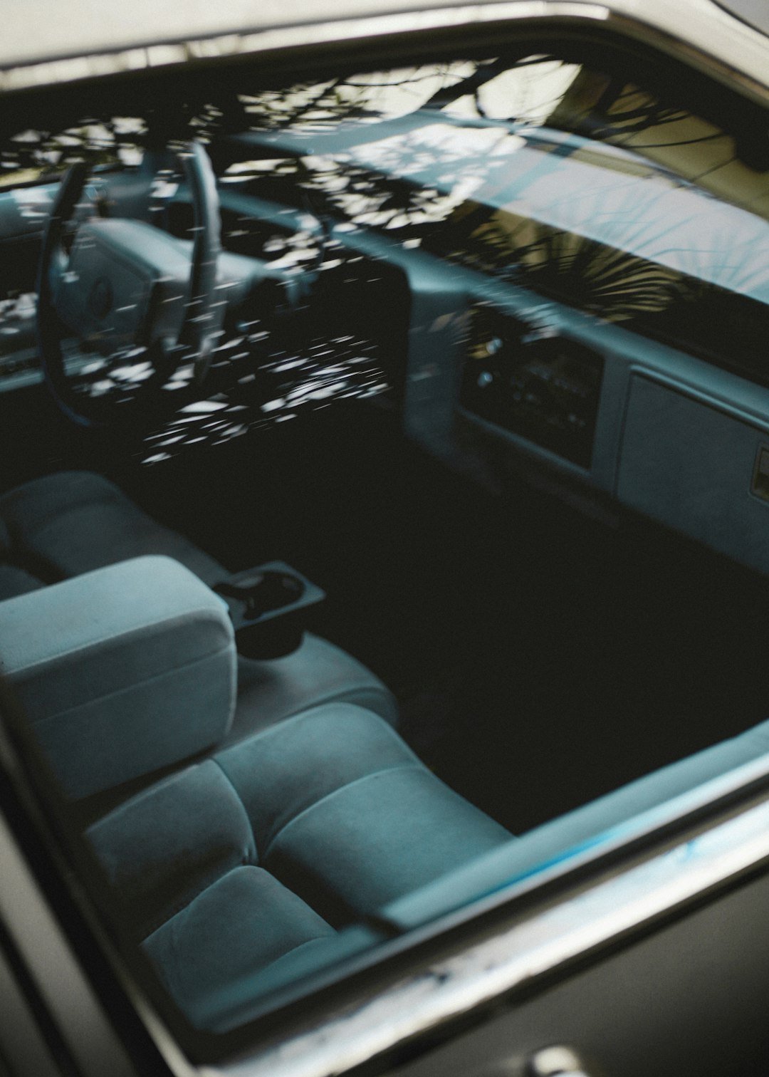the interior of a car with a steering wheel and dashboard