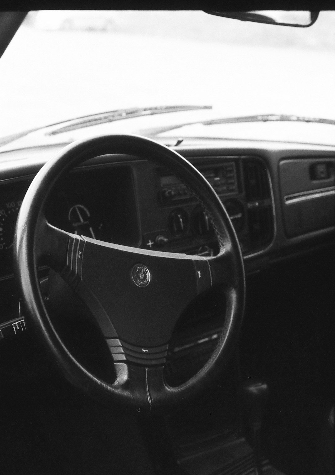 a black and white photo of a car dashboard