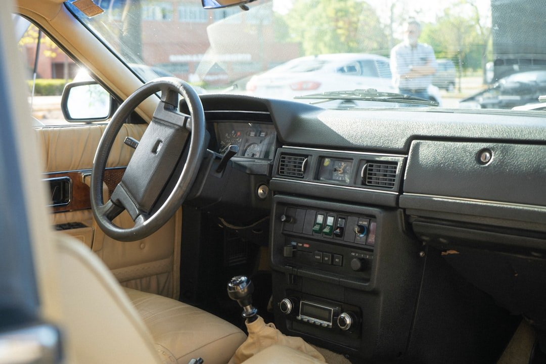 the interior of a car with a dash board and steering wheel