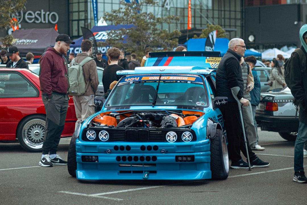 Modified BMW at an outdoor car show.